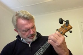 Sam Neill playing 'Uptown Funk' on a ukulele